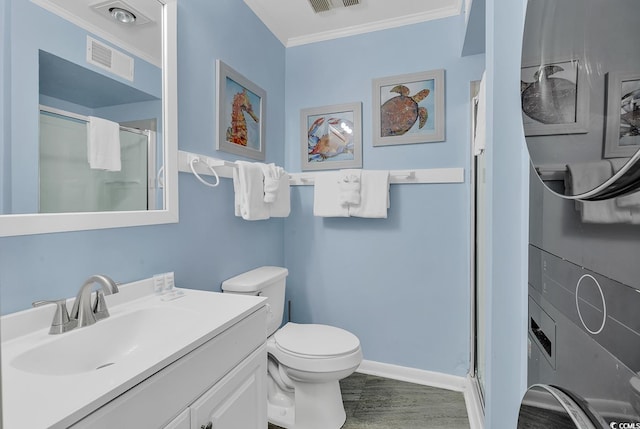 1310 N Waccamaw Dr Unit 208, Garden City Beach, SC 29576 - full bath with a shower stall, ornamental molding, vanity, toilet, and wood finished floors
