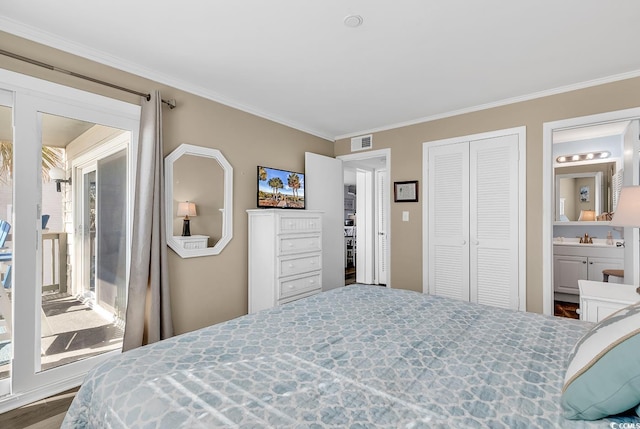 1310 N Waccamaw Dr Unit 208, Garden City Beach, SC 29576 - bedroom with ornamental molding, a closet, ensuite bathroom, and wood finished floors