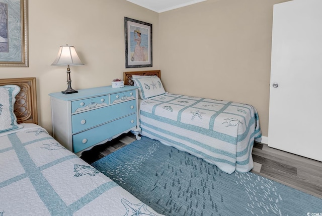 1310 N Waccamaw Dr Unit 208, Garden City Beach, SC 29576 - bedroom featuring wood finished floors and ornamental molding