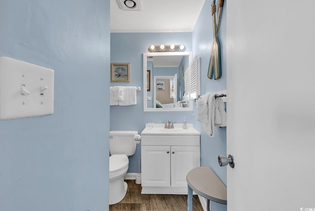 1310 N Waccamaw Dr Unit 208, Garden City Beach, SC 29576 - half bath with toilet, vanity, baseboards, and wood finished floors