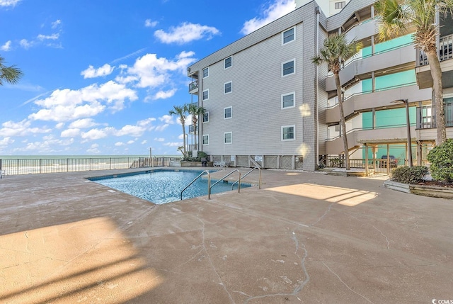 1310 N Waccamaw Dr Unit 208, Garden City Beach, SC 29576 - community pool with a patio area