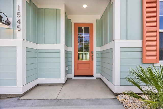 1545 Coastal Cove Ln, Calabash, NC 28467 - doorway to property featuring board and batten siding