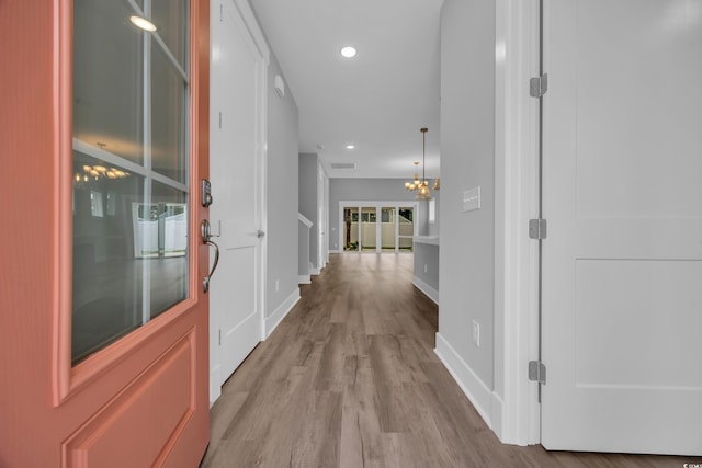 1545 Coastal Cove Ln, Calabash, NC 28467 - corridor with baseboards, wood finished floors, a chandelier, and recessed lighting