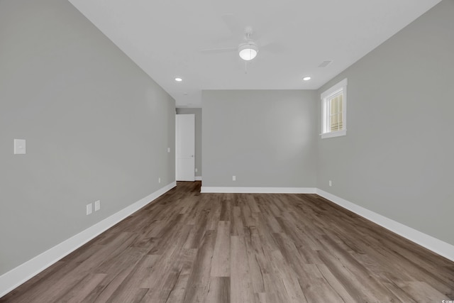 1545 Coastal Cove Ln, Calabash, NC 28467 - unfurnished room featuring wood finished floors, baseboards, a ceiling fan, and recessed lighting