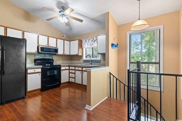 752 Tall Oaks Ct, Myrtle Beach, SC 29588 - kitchen featuring black appliances, a sink, white cabinets, dark wood finished floors, and lofted ceiling