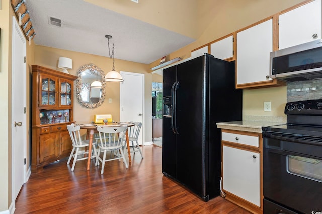 752 Tall Oaks Ct, Myrtle Beach, SC 29588 - kitchen featuring black appliances, light countertops, dark wood-style floors, and white cabinets