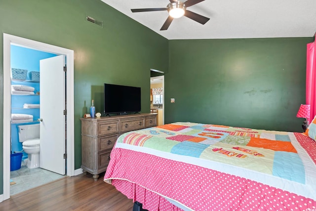 752 Tall Oaks Ct, Myrtle Beach, SC 29588 - bedroom featuring lofted ceiling, wood finished floors, connected bathroom, and a ceiling fan