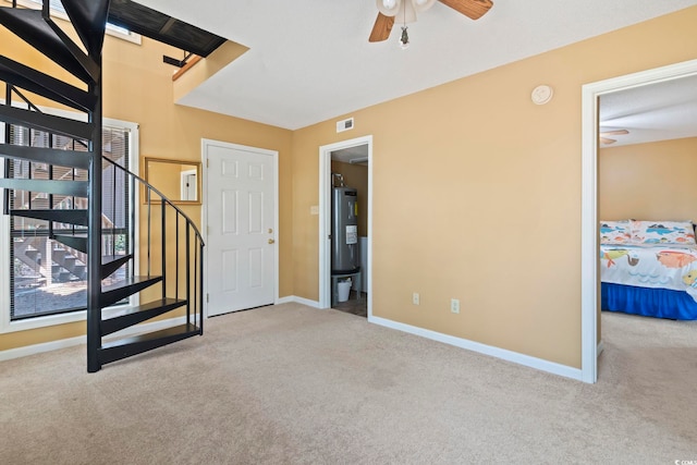 752 Tall Oaks Ct, Myrtle Beach, SC 29588 - entryway with carpet floors, ceiling fan, electric water heater, and baseboards