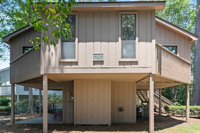 752 Tall Oaks Ct, Myrtle Beach, SC 29588 - back of house with stairway, a patio area, and central air condition unit
