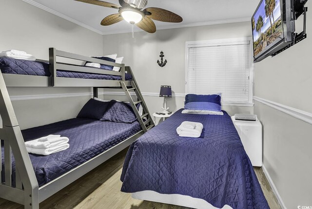 9660 Shore Dr Unit 208, Myrtle Beach, SC 29572 - bedroom with crown molding, wood finished floors, and ceiling fan