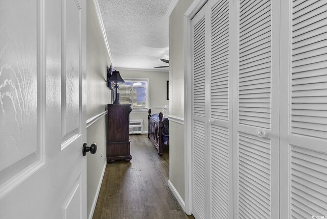 9660 Shore Dr Unit 208, Myrtle Beach, SC 29572 - hall featuring wood finished floors, a textured ceiling, and a wainscoted wall