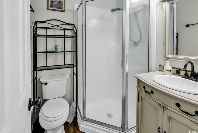9660 Shore Dr Unit 208, Myrtle Beach, SC 29572 - bathroom with a shower stall, vanity, and toilet