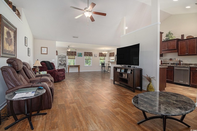 95 Timber Run Dr, Georgetown, SC 29440 - living area with a ceiling fan, light wood-style floors, a chandelier, and high vaulted ceiling