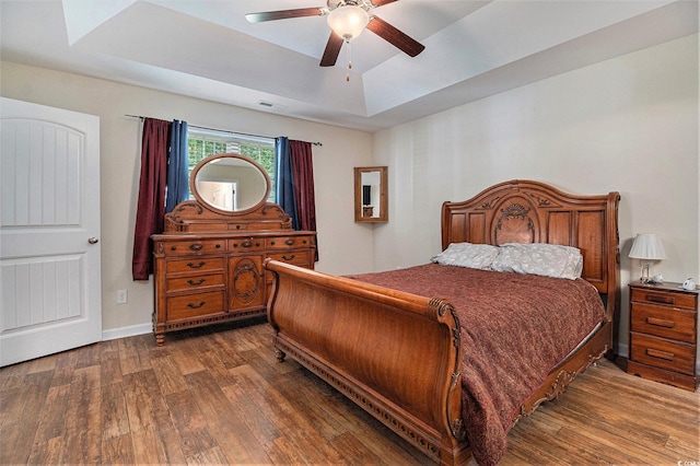 95 Timber Run Dr, Georgetown, SC 29440 - bedroom with a raised ceiling, wood finished floors, and a ceiling fan