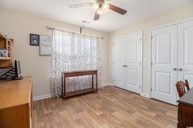 95 Timber Run Dr, Georgetown, SC 29440 - bedroom featuring multiple closets, wood finished floors, and ceiling fan