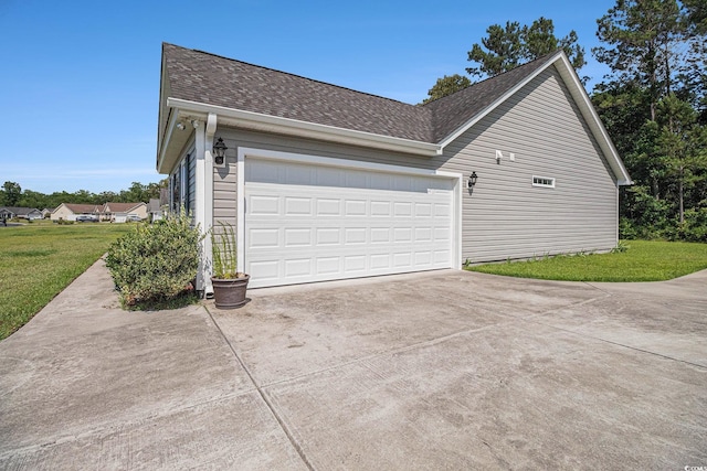 95 Timber Run Dr, Georgetown, SC 29440 - view of side of home with concrete driveway, roof with shingles, a lawn, and a garage