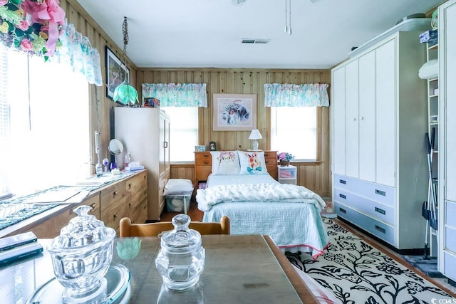404 13th Ave S, Myrtle Beach, SC 29577 - bedroom featuring multiple windows and wooden walls
