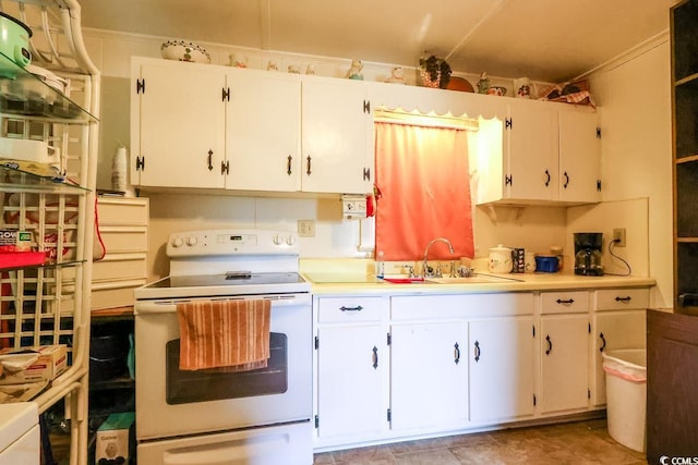 404 13th Ave S, Myrtle Beach, SC 29577 - kitchen featuring white electric stove, a sink, light countertops, and white cabinetry