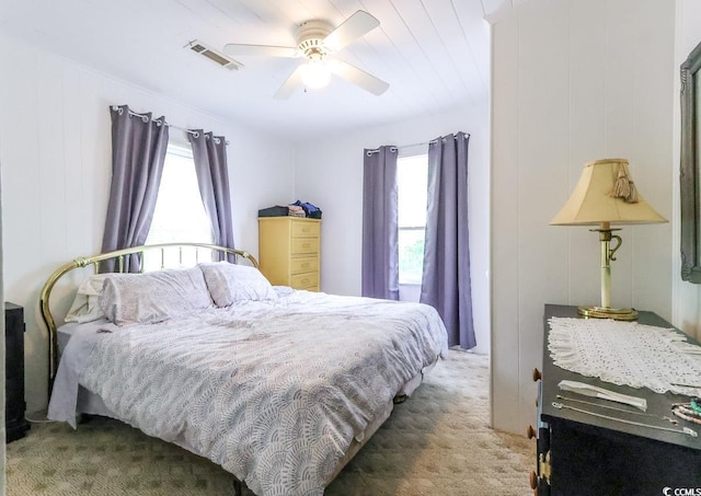 404 13th Ave S, Myrtle Beach, SC 29577 - carpeted bedroom with multiple windows and a ceiling fan