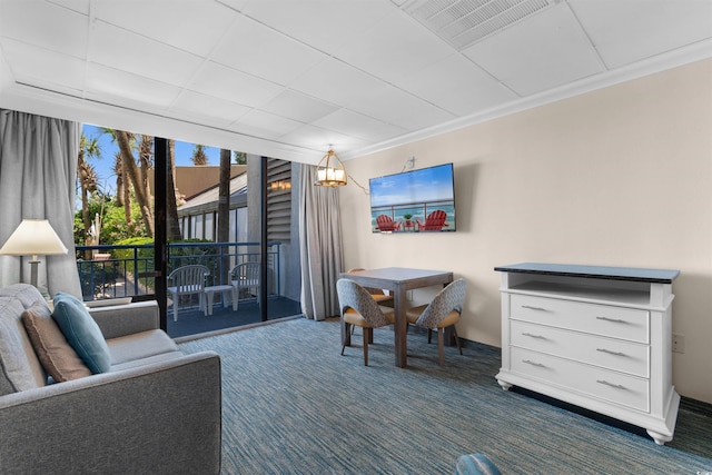 1105 S Ocean Blvd Unit 110, Myrtle Beach, SC 29577 - living room with dark carpet and crown molding