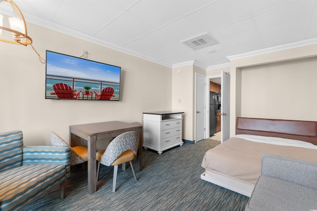 1105 S Ocean Blvd Unit 110, Myrtle Beach, SC 29577 - carpeted bedroom featuring freestanding refrigerator and crown molding