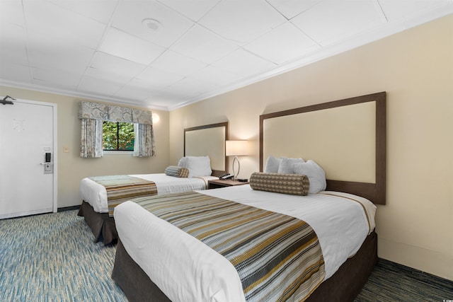 1105 S Ocean Blvd Unit 110, Myrtle Beach, SC 29577 - carpeted bedroom with crown molding and baseboards
