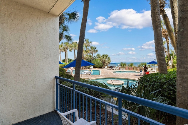 1105 S Ocean Blvd Unit 110, Myrtle Beach, SC 29577 - balcony featuring view of pool and a patio area