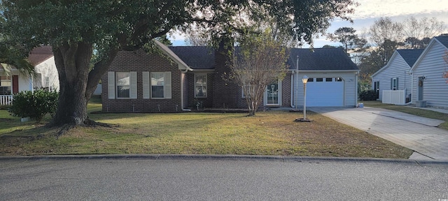 404 Snowy Egret Dr, Murrells Inlet, SC 29576 - view of front of house with driveway, an attached garage, a front lawn, and brick siding