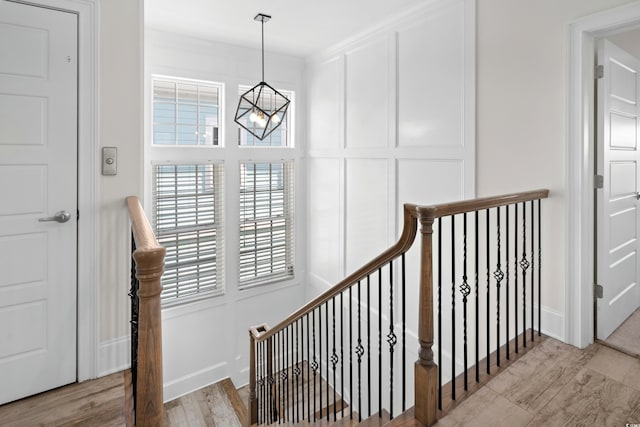208 W Palms Dr, Myrtle Beach, SC 29579 - staircase with a chandelier, wood finished floors, and baseboards