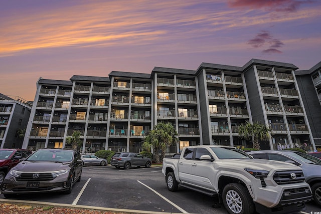 5905 S Kings Hwy Unit A518, Myrtle Beach, SC 29575 - property at dusk with uncovered parking