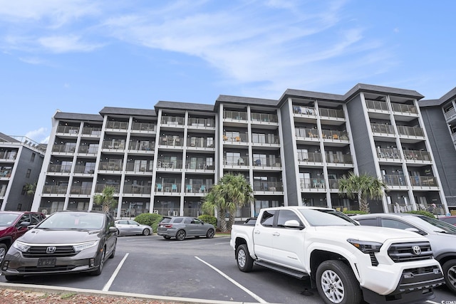 5905 S Kings Hwy Unit A518, Myrtle Beach, SC 29575 - view of apartment building / complex featuring uncovered parking