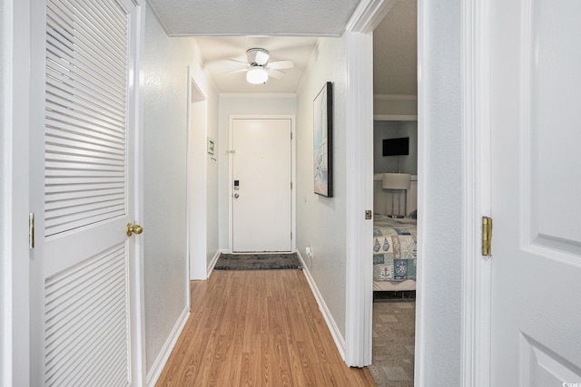 5905 S Kings Hwy Unit A518, Myrtle Beach, SC 29575 - hallway featuring light wood-style flooring, baseboards, and crown molding