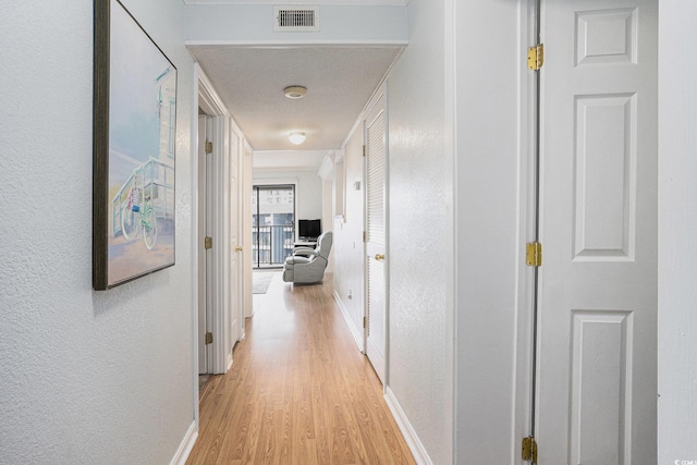 5905 S Kings Hwy Unit A518, Myrtle Beach, SC 29575 - corridor featuring light wood-style flooring, baseboards, and a textured wall