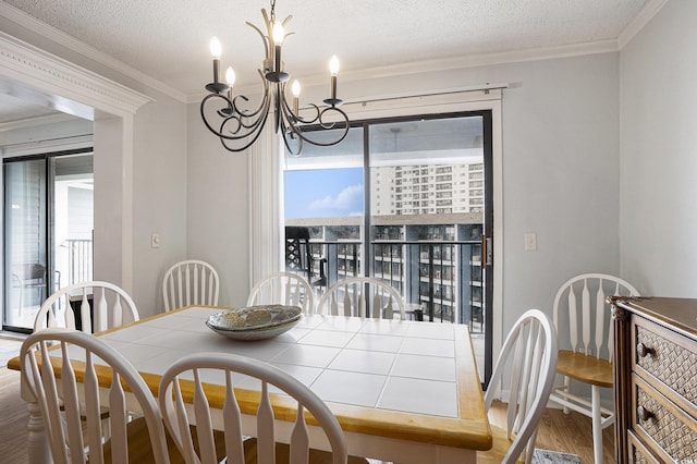 5905 S Kings Hwy Unit A518, Myrtle Beach, SC 29575 - dining space featuring wood finished floors, a chandelier, and ornamental molding