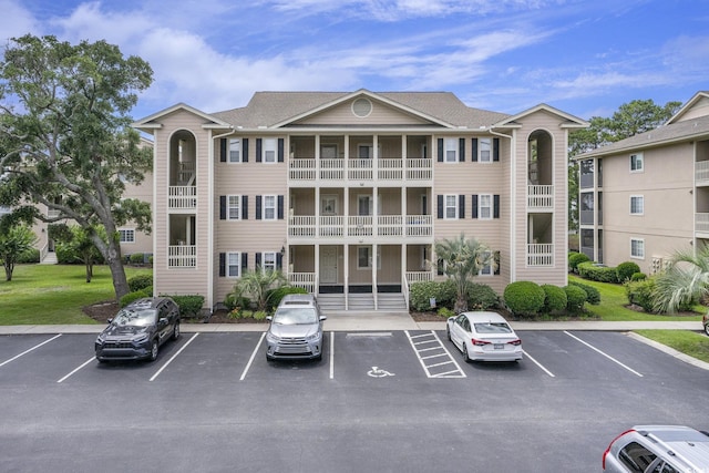1900 Duffy St Unit H-8, North Myrtle Beach, SC 29582 - view of building exterior with uncovered parking