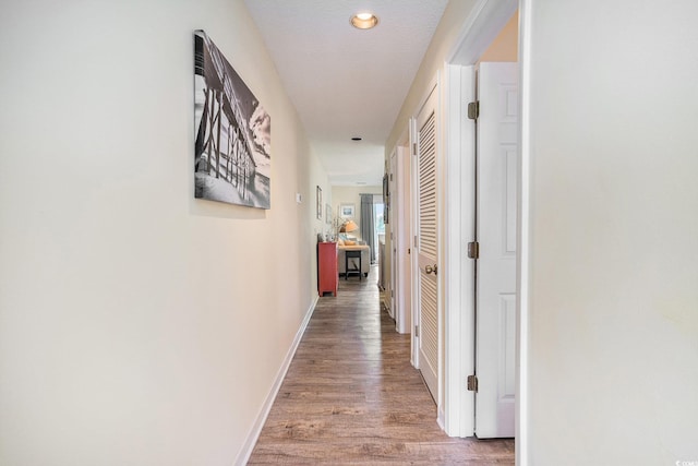 1900 Duffy St Unit H-8, North Myrtle Beach, SC 29582 - hall featuring light wood-style flooring, baseboards, and recessed lighting