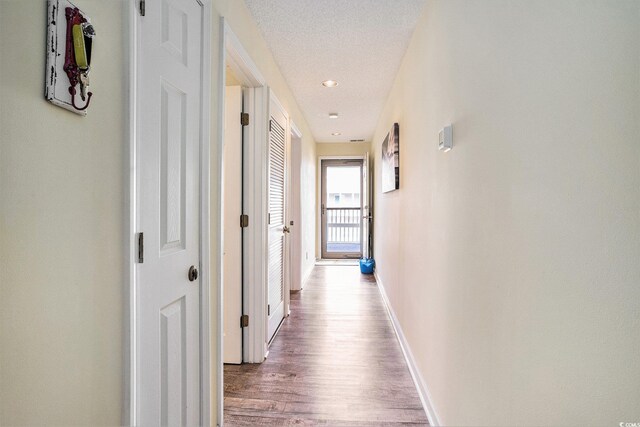 1900 Duffy St Unit H-8, North Myrtle Beach, SC 29582 - hallway featuring baseboards and wood finished floors
