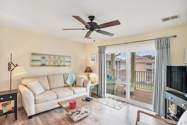 1900 Duffy St Unit H-8, North Myrtle Beach, SC 29582 - living area featuring a ceiling fan, wood finished floors, and baseboards