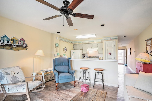 1900 Duffy St Unit H-8, North Myrtle Beach, SC 29582 - living room with light wood finished floors, a ceiling fan, and baseboards