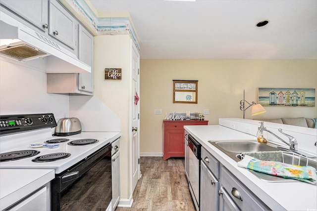 1900 Duffy St Unit H-8, North Myrtle Beach, SC 29582 - kitchen featuring range with electric stovetop, light wood-type flooring, dishwasher, a sink, and light countertops