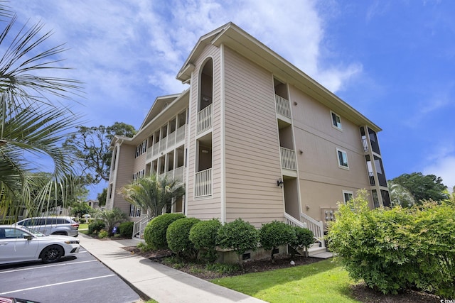 1900 Duffy St Unit H-8, North Myrtle Beach, SC 29582 - view of building exterior with uncovered parking