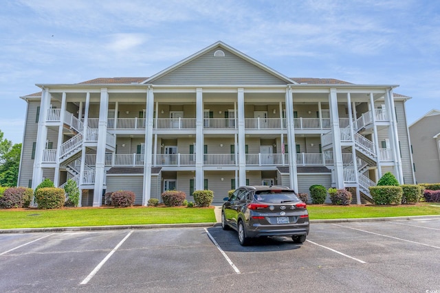 5852 Longwood Dr Unit 302, Murrells Inlet, SC 29576 - view of apartment building / complex featuring uncovered parking