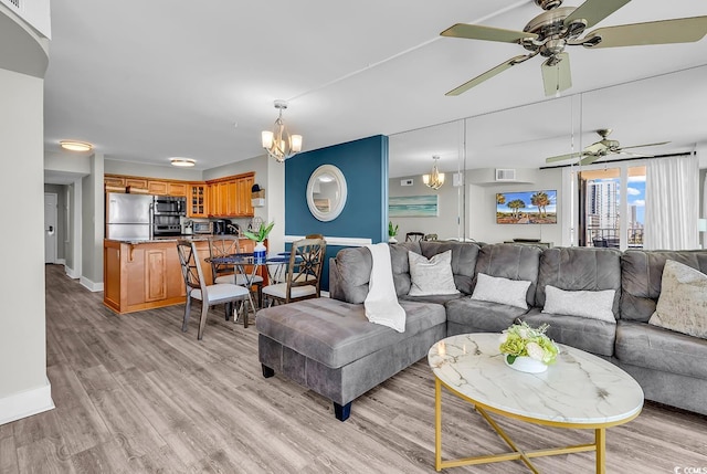 2500 N Ocean Blvd Unit 1102, Myrtle Beach, SC 29577 - living room featuring a chandelier, light wood finished floors, and ceiling fan