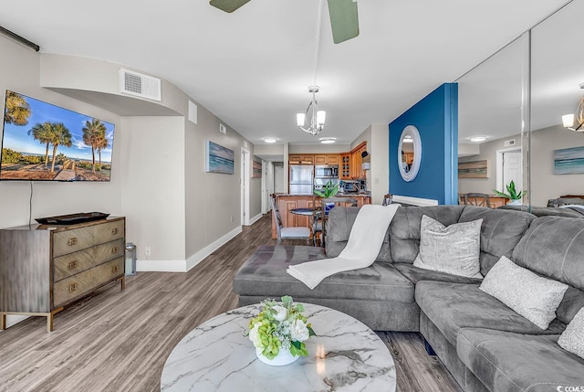 2500 N Ocean Blvd Unit 1102, Myrtle Beach, SC 29577 - living room with wood finished floors and a chandelier