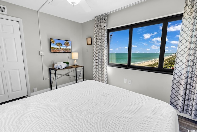 2500 N Ocean Blvd Unit 1102, Myrtle Beach, SC 29577 - bedroom with dark wood-style floors and ceiling fan
