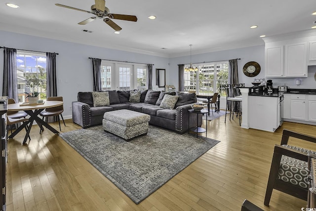 113-A Vista Dr, Garden City Beach, SC 29576 - living room featuring plenty of natural light, a ceiling fan, light wood-type flooring, ornamental molding, and recessed lighting