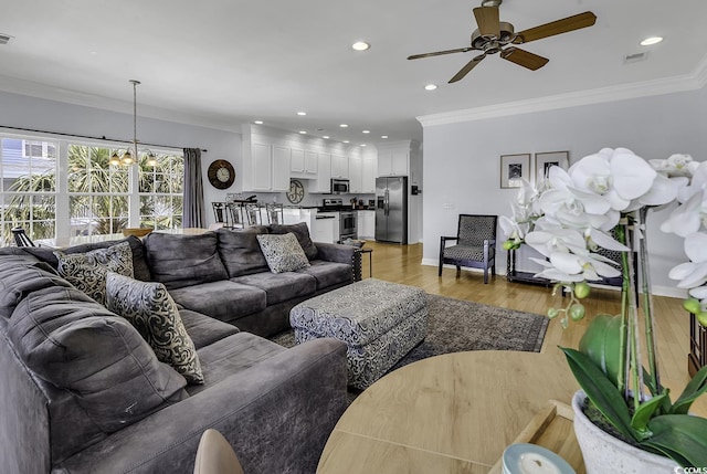 113-A Vista Dr, Garden City Beach, SC 29576 - living area with ceiling fan, light wood-type flooring, ornamental molding, a chandelier, and recessed lighting