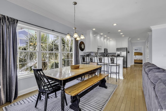 113-A Vista Dr, Garden City Beach, SC 29576 - dining space featuring crown molding, light wood-style floors, a chandelier, recessed lighting, and baseboards