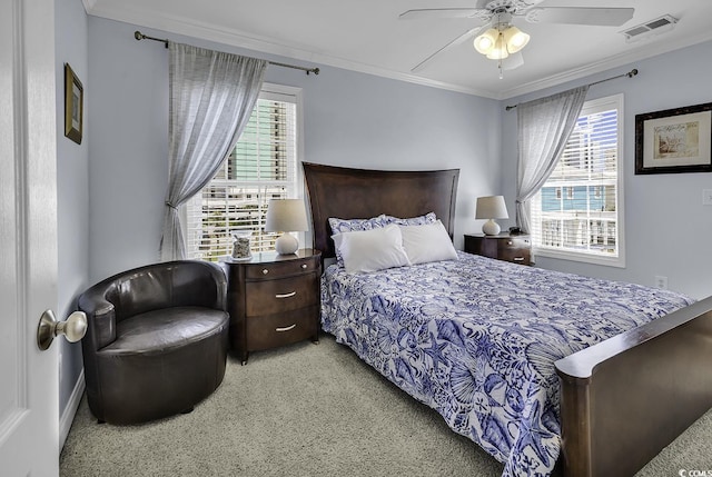 113-A Vista Dr, Garden City Beach, SC 29576 - bedroom featuring multiple windows, crown molding, light colored carpet, ceiling fan, and baseboards