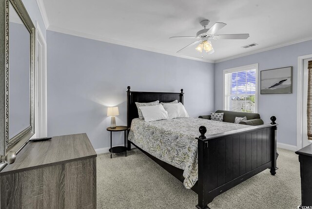 113-A Vista Dr, Garden City Beach, SC 29576 - bedroom featuring light colored carpet, baseboards, ornamental molding, and ceiling fan